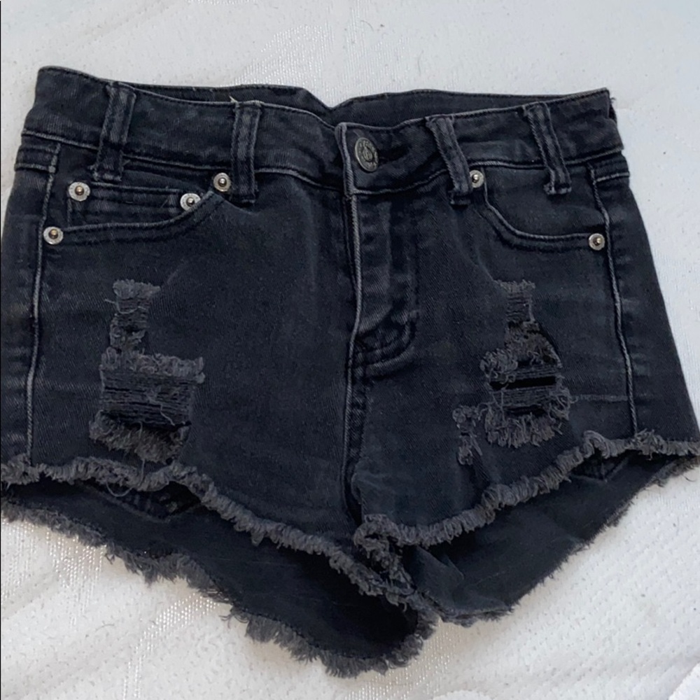 black ripped shorts